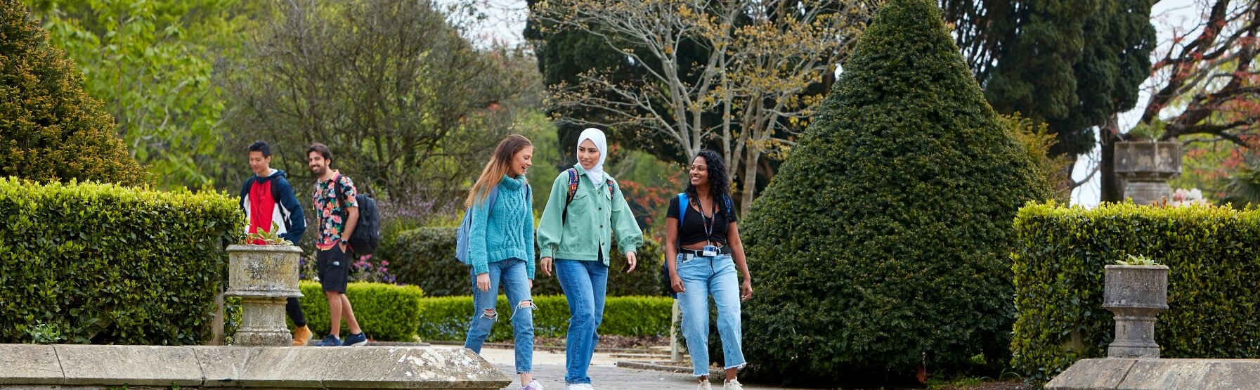 Students walking near the Abbey on Singleton Campus.