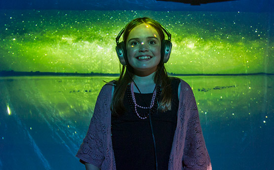 Young visitor in immersive experience