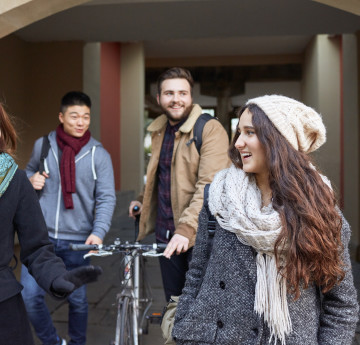 Three students walking through Singleton Campus