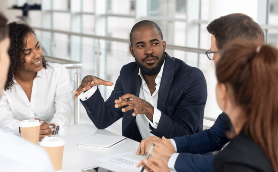 Students in a boardroom.