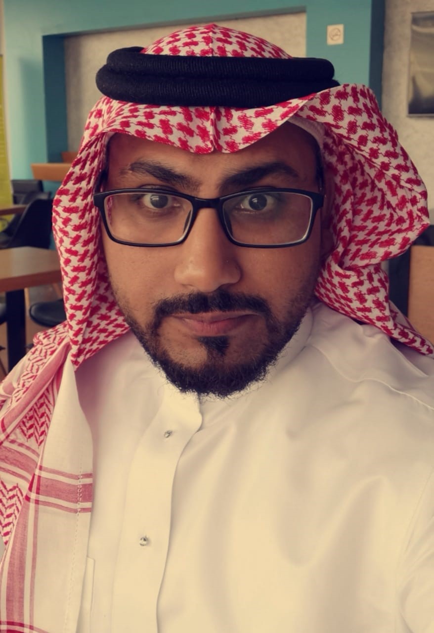 Male student wearing a keffiyeh (Arabian headdress)