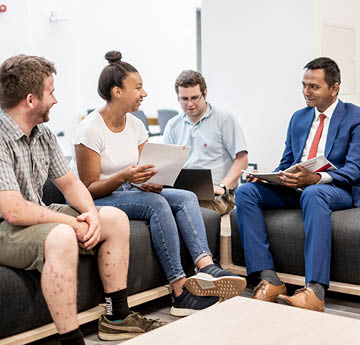 students sitting on a sofa