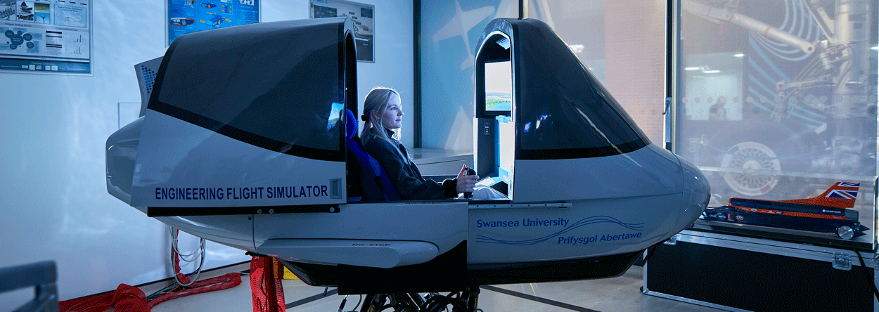 Female student on flight simulator computer