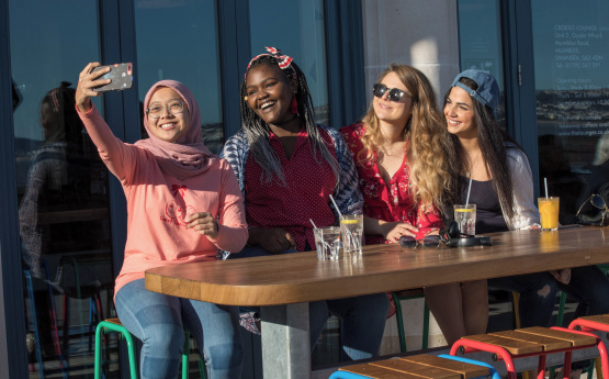 Students taking a selfie. 