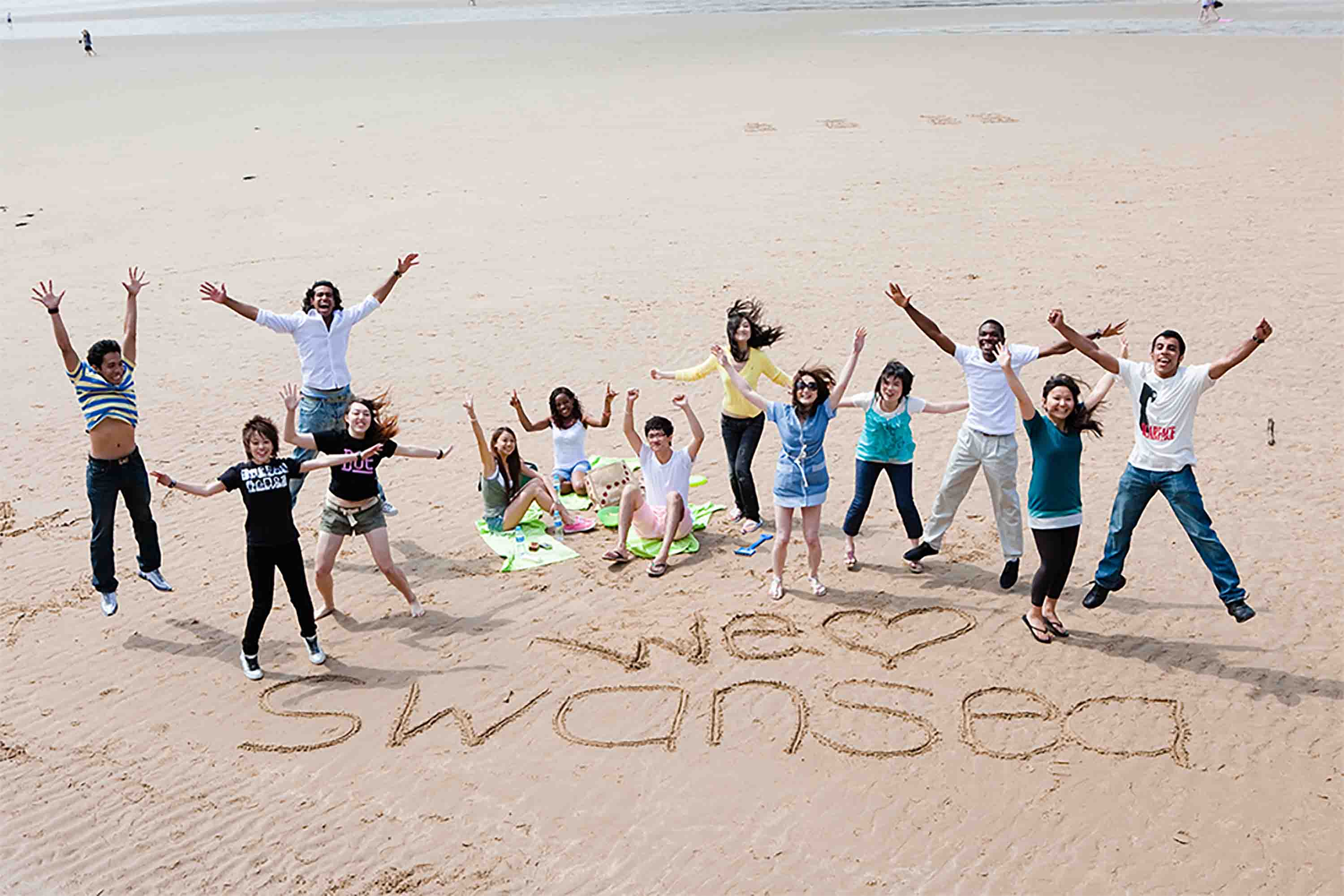 students on Swansea beach