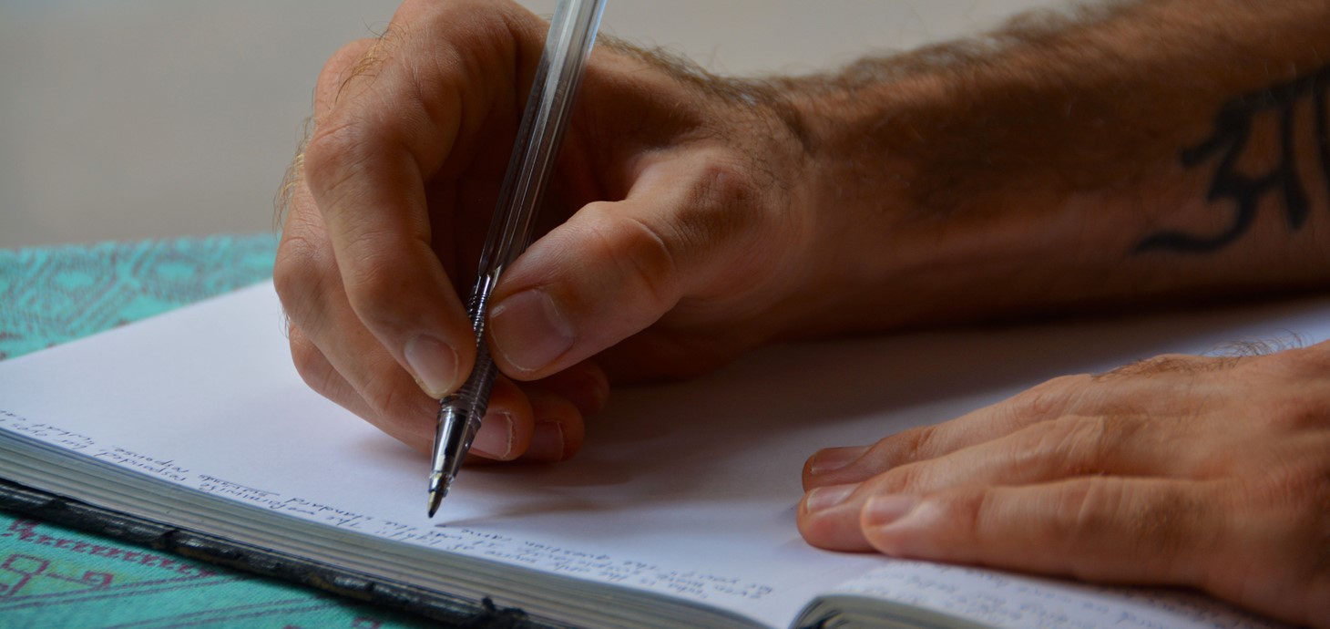 Man writing in a journal