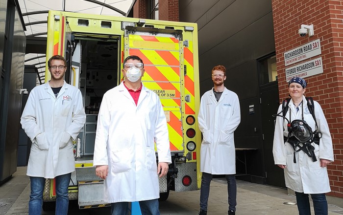 (L-r) Ed Lester-Card, Dr Chedly Tizaoui, Anthony Lewis and Dr Karen Perkins of Swansea University College of Engineering, with the demonstration ambulance used to test out their speed-cleaning procedure