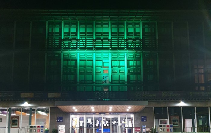 To mark Recycling Week, the University has given its backing to WRAP Cymru’s Be Mighty. Recycle campaign and is showing its support by turning Fulton House green this week.