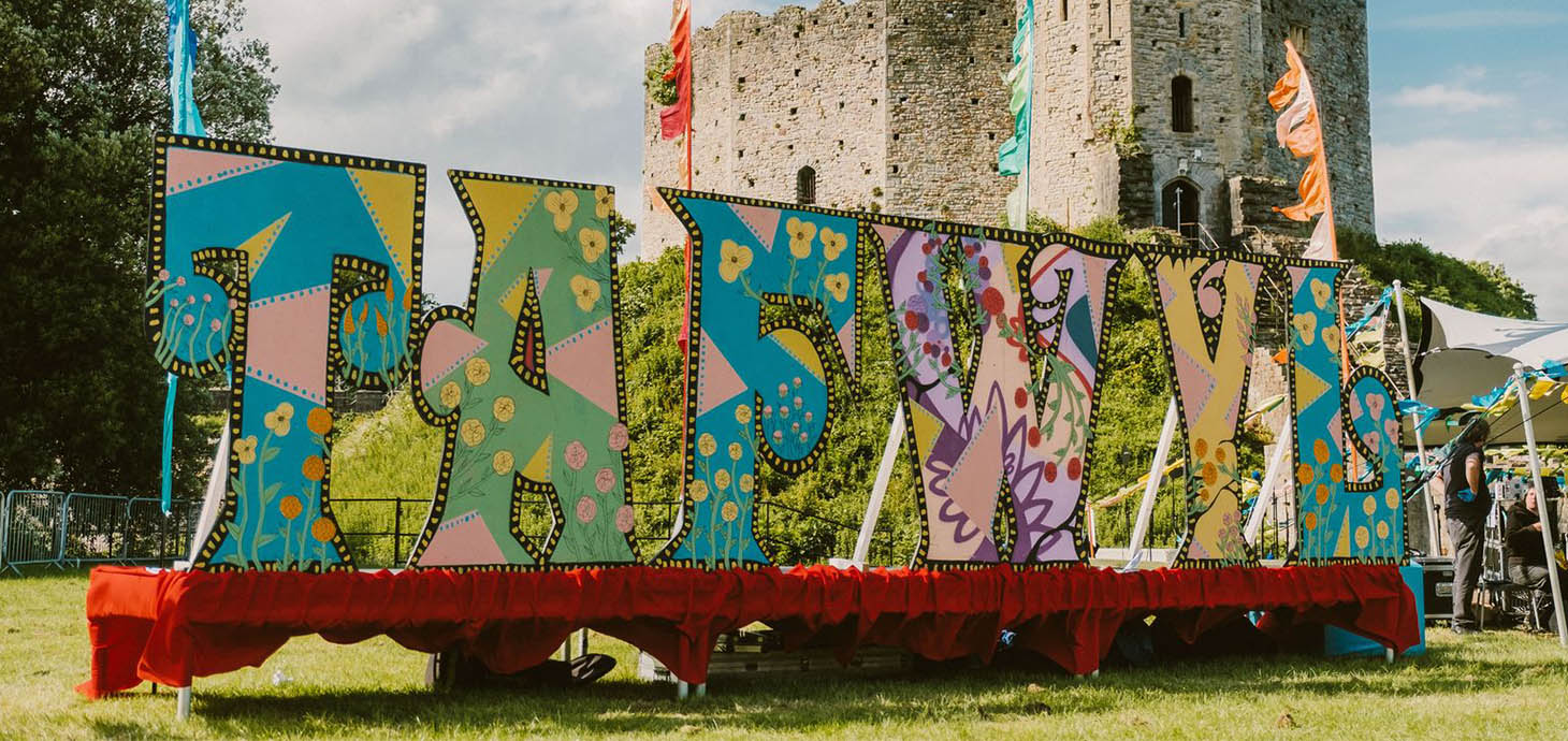 Colourful large lettering spelling Tafwyl outside Cardiff Castle 