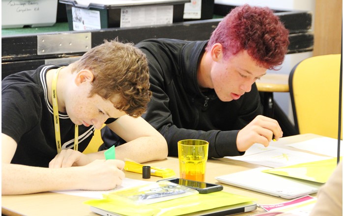 Two pupils working at a Technocamps event, before Covid; new workbooks will allow pupils without internet access to study STEM subjects even if schools are closed