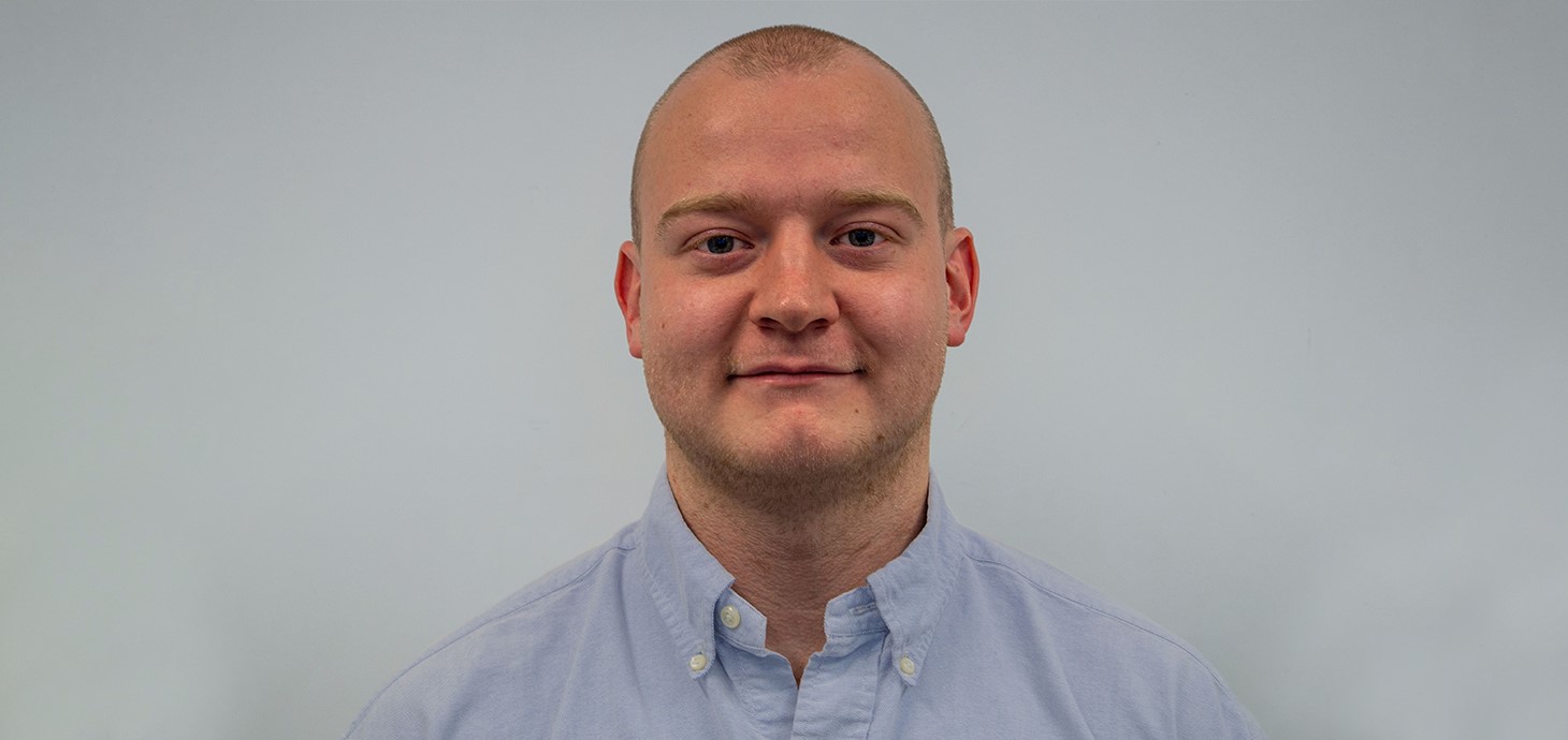 A headshot of Swansea University PhD research student, Thomas Spriggs.