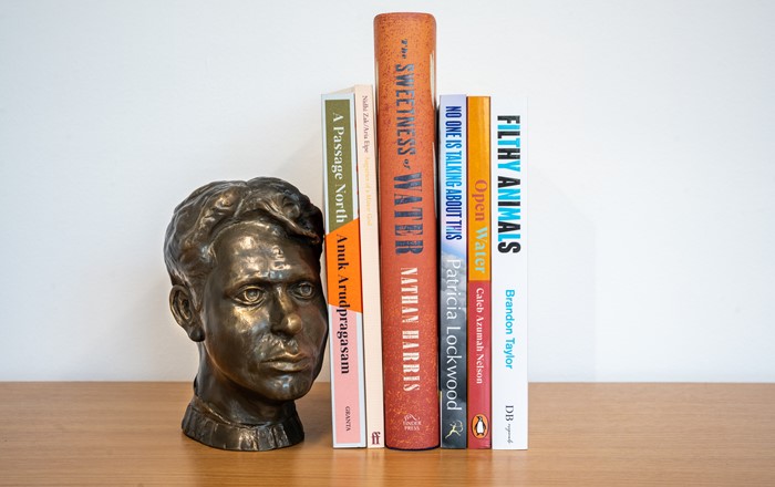 The books featured on this year's shortlist next to a small bust of Dylan Thomas 