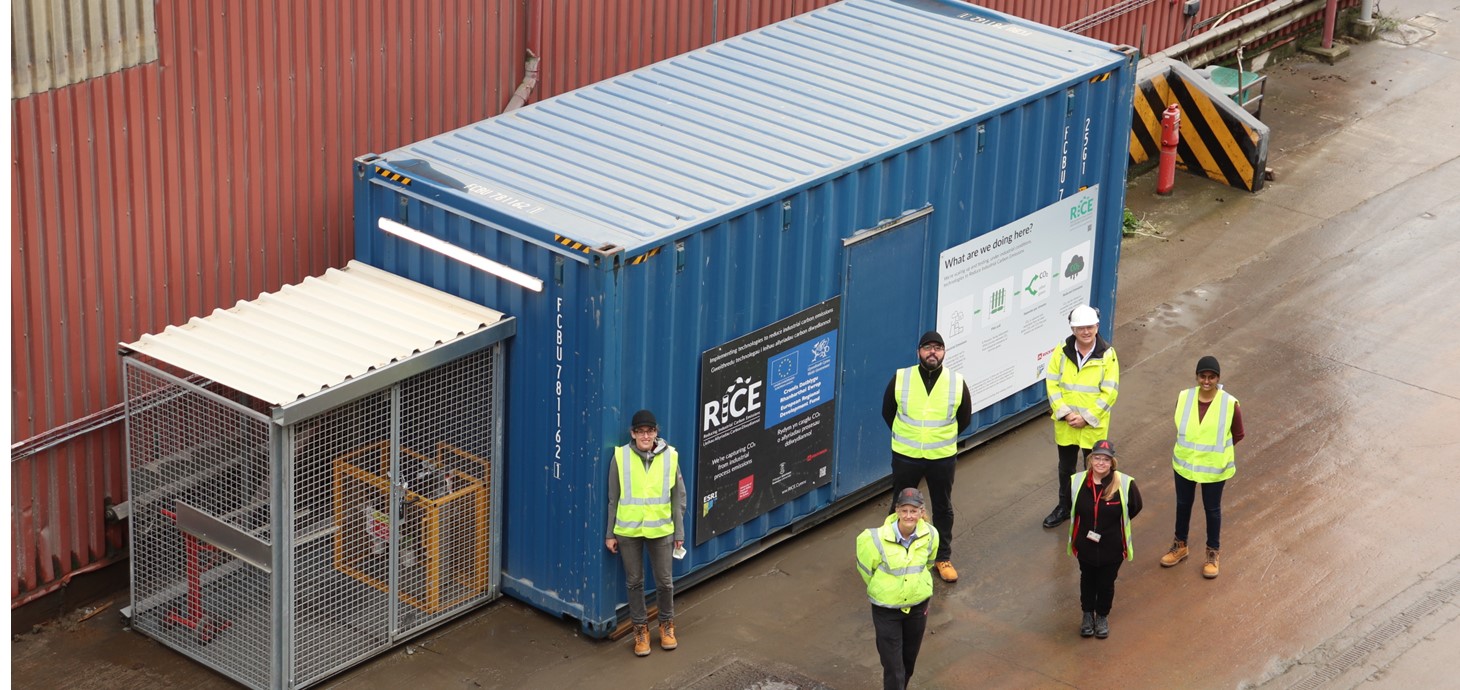 Aerial shot of six members of the RICE and ROCKWOOL team shown at the demonstration unit following its successful installation.