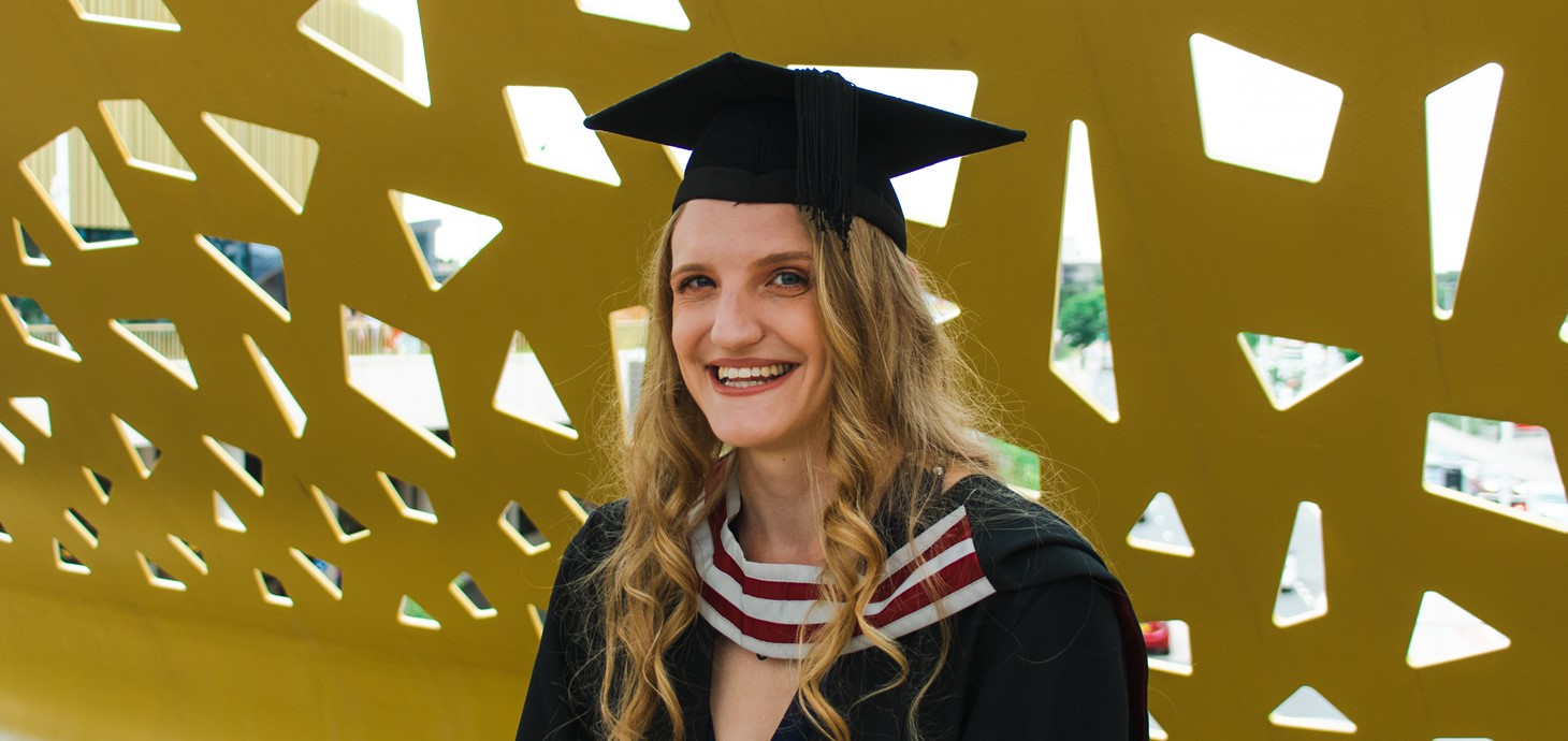 Jessica Smith in her graduation cap and gown.