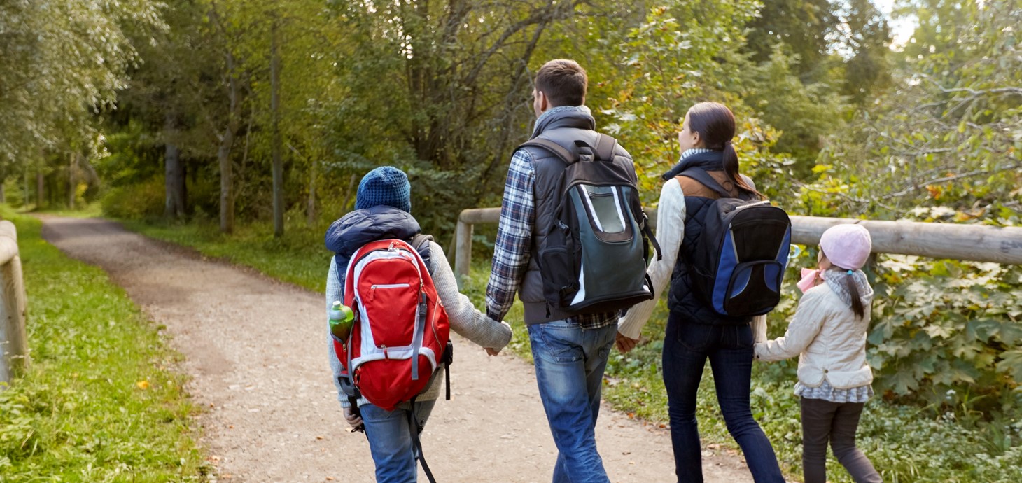 A family going for a walk outdoors.