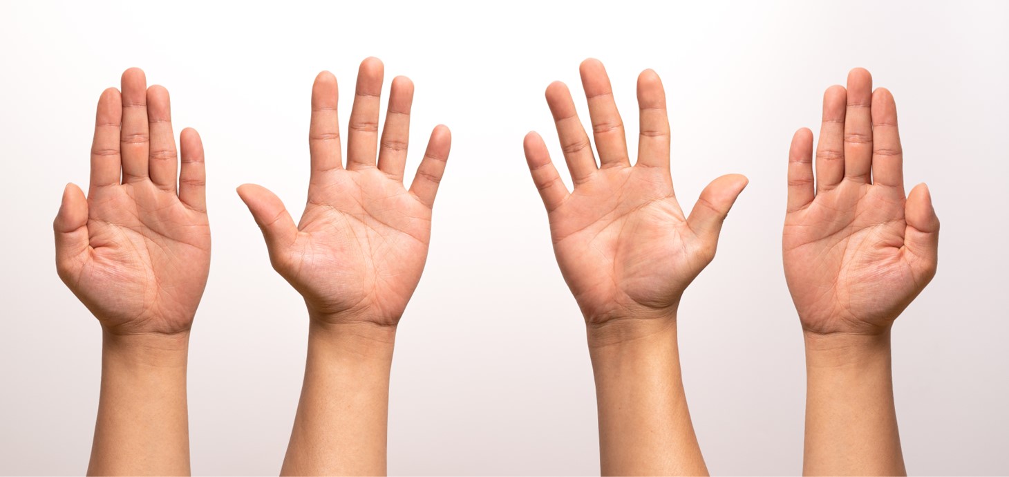 Two pairs of hands with outstretched fingers