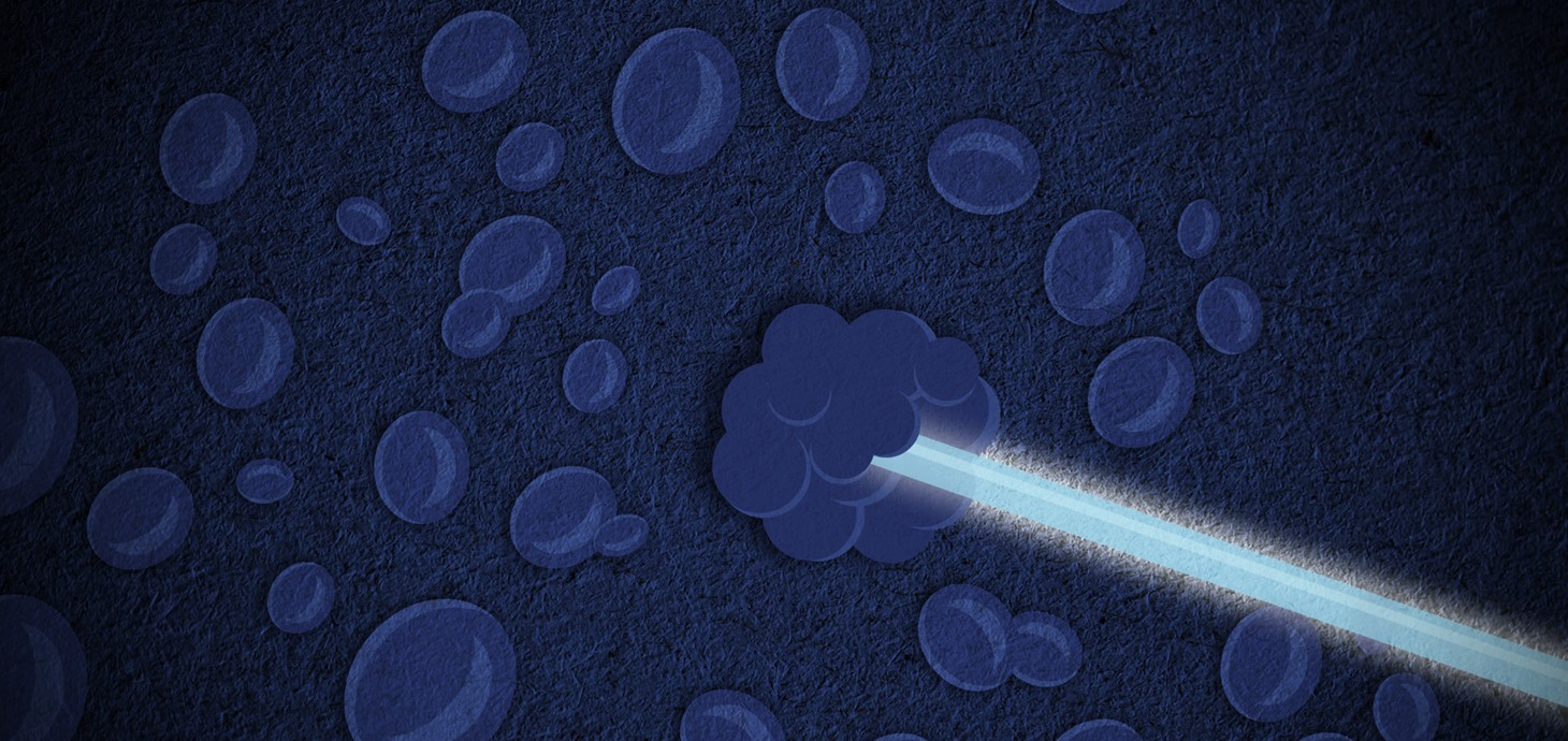 Illustration of blue beam of light, which represents a proton beam targeting a blue cell, which represent a cancer cell. 