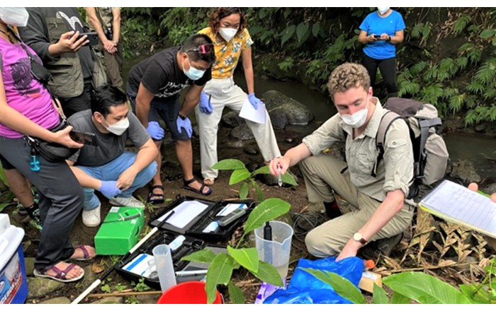 Aaron Todd (right) with Filipino colleagues.  He conducted fieldwork with a team of eight researchers across two river catchments, collecting water and sediment samples