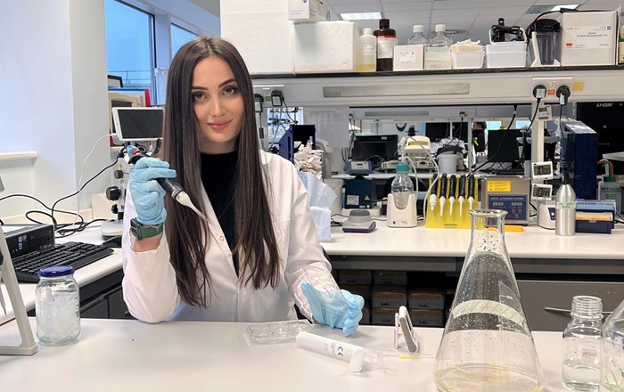 Mariia Hryhorian in the labs at Swansea University Medical School, where she is currently spending a semester as one of the first students to benefit from Swansea's partnership with her home university in Ukraine