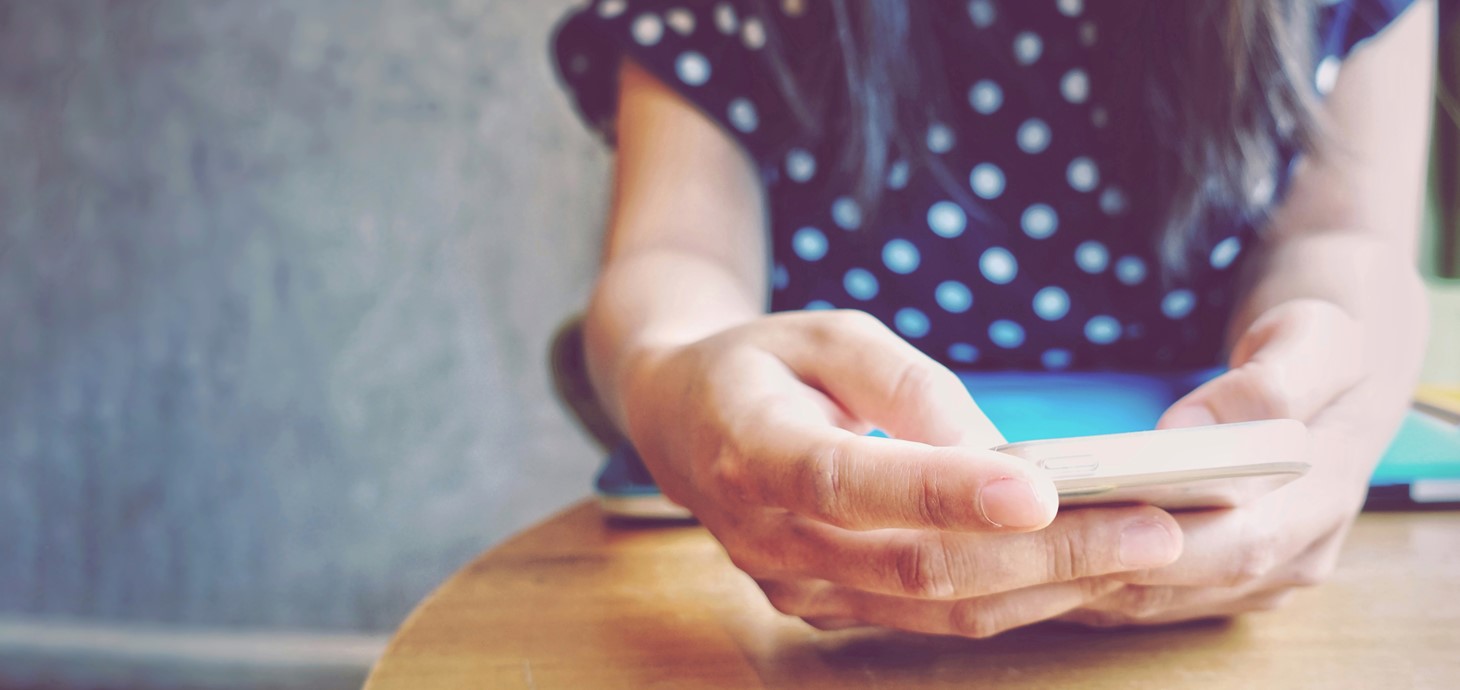 Close-up of a woman using a smart phone.