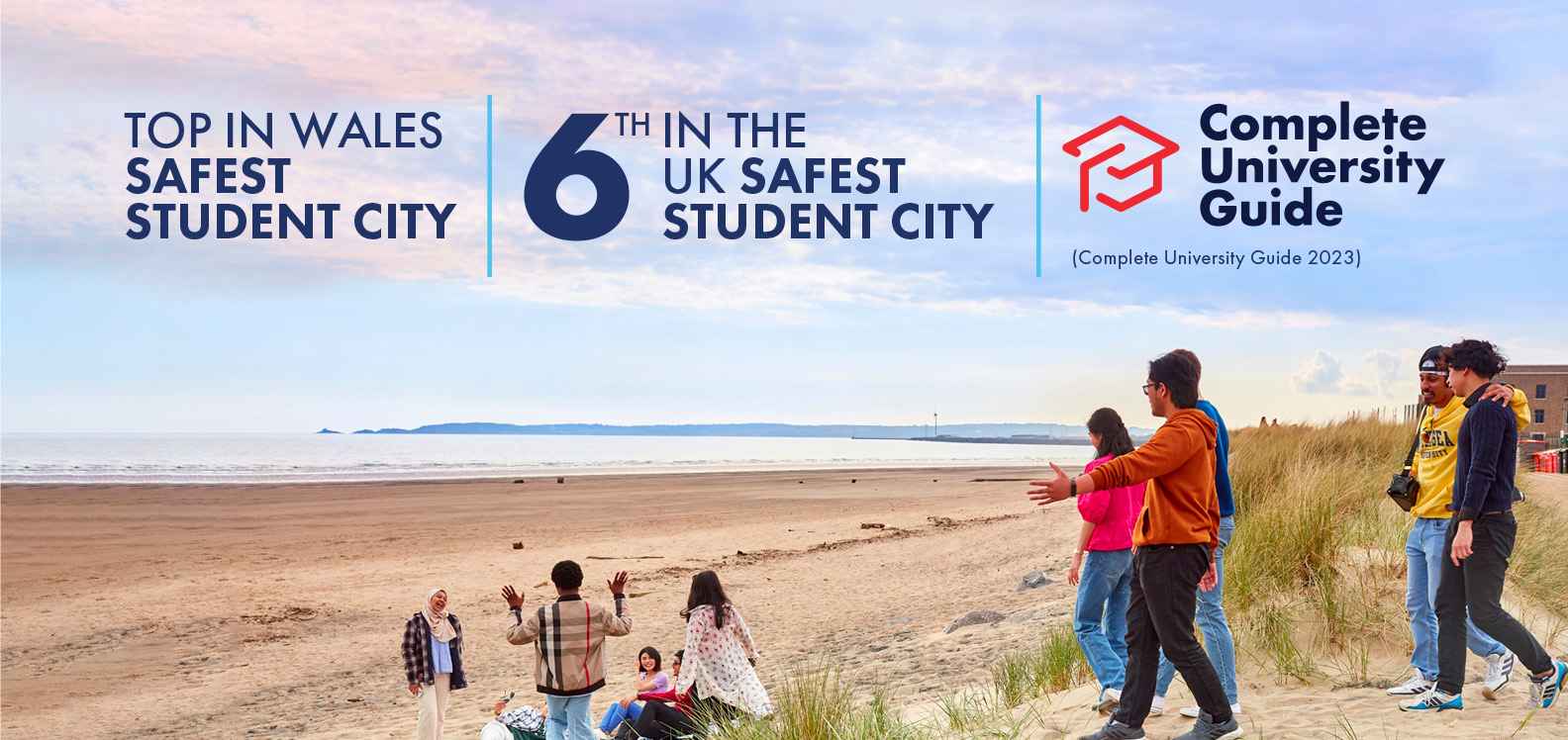 A group of students walking on the beach and the Complete University Guide logo. TEXT: Top in Wales Safest Student City (Complete University Guide 2023) | 6th in the UK Safest Student City (Complete University Guide 2023)