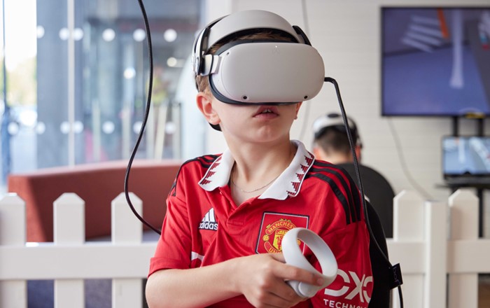 A child wearing a virtual reality headset.
