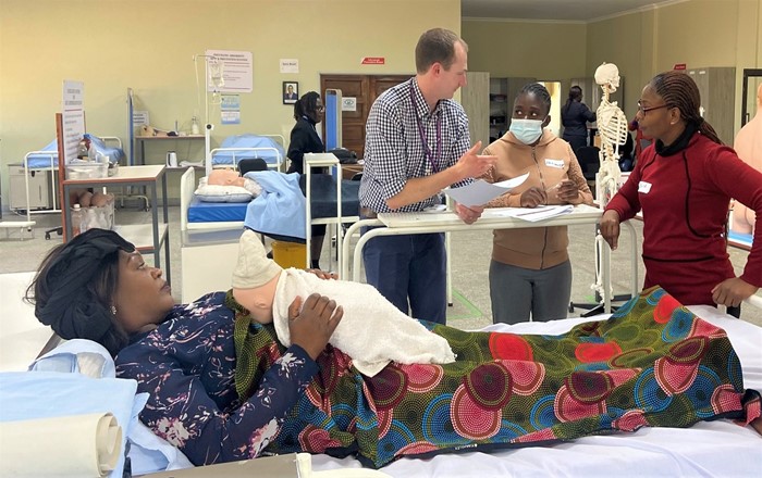 Dr David Lee (centre) of Swansea University Medical School with Zambian health professionals at the clinical simulation workshop. Swansea has significant expertise in the field through its SUSIM centre and in developing highly realistic clinical simulation scenarios for student training.