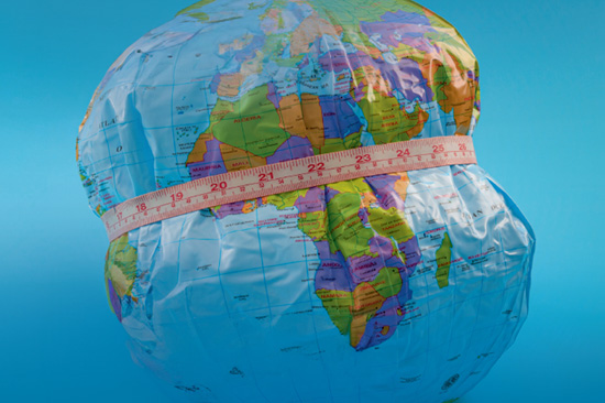 A graphic of an inflatable globe with a measuring tape around it.