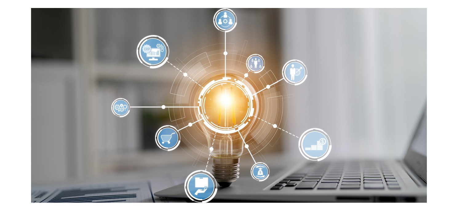 Image of computer keyboard with bright light bulb 