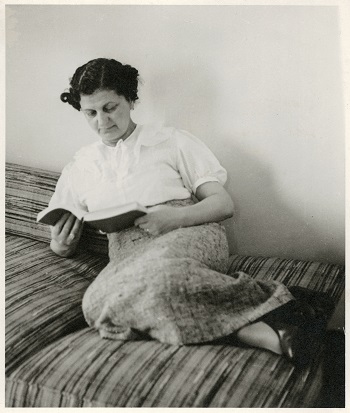 black and white image of a woman reading