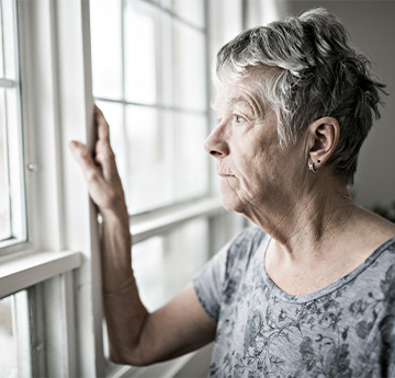 Elderly looking out of the window