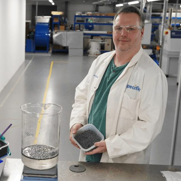 Dr Jon Elvins holding the Salt in Matrix (SIM) material that has been developed as part of the project into capturing the heat from industrial waste gases