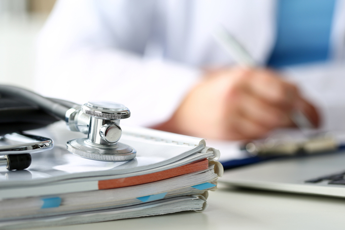 image of paperwork and a stethoscope
