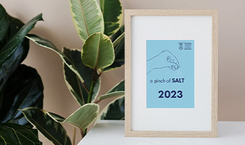 A photo frame containing an image of the Pinch of SALT logo