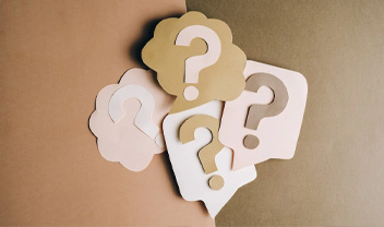 Cardboard cut outs of question marks