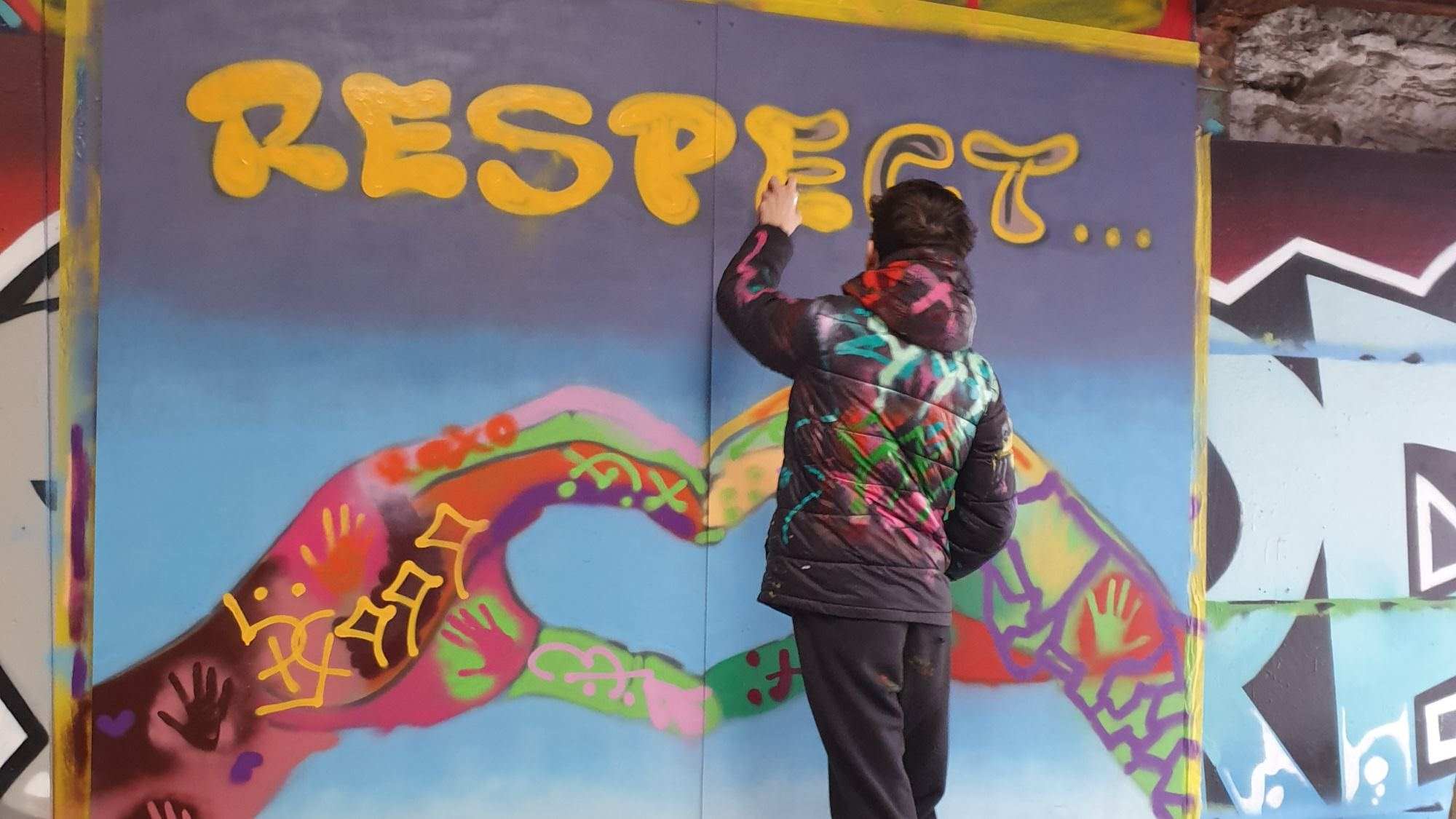 Respect mural being painted