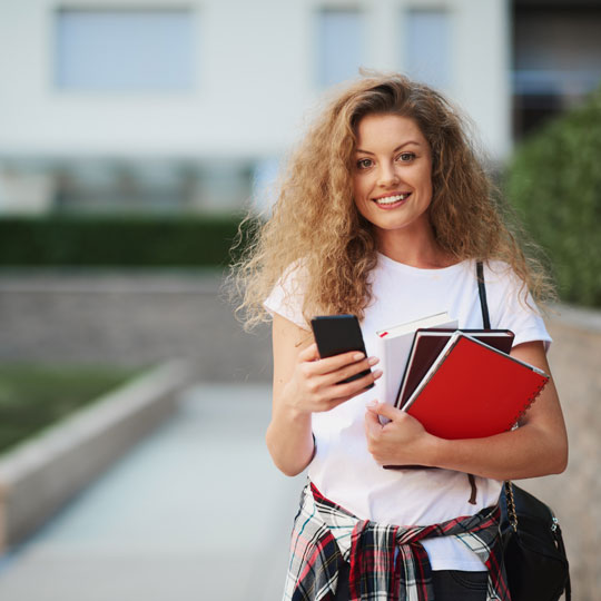 student smiling at the camera