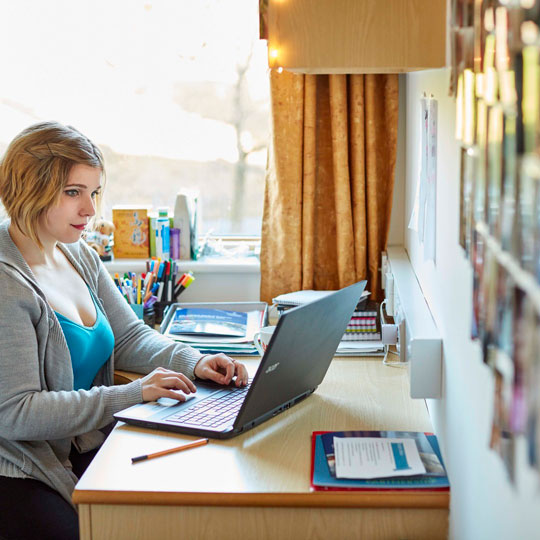 student working on laptop