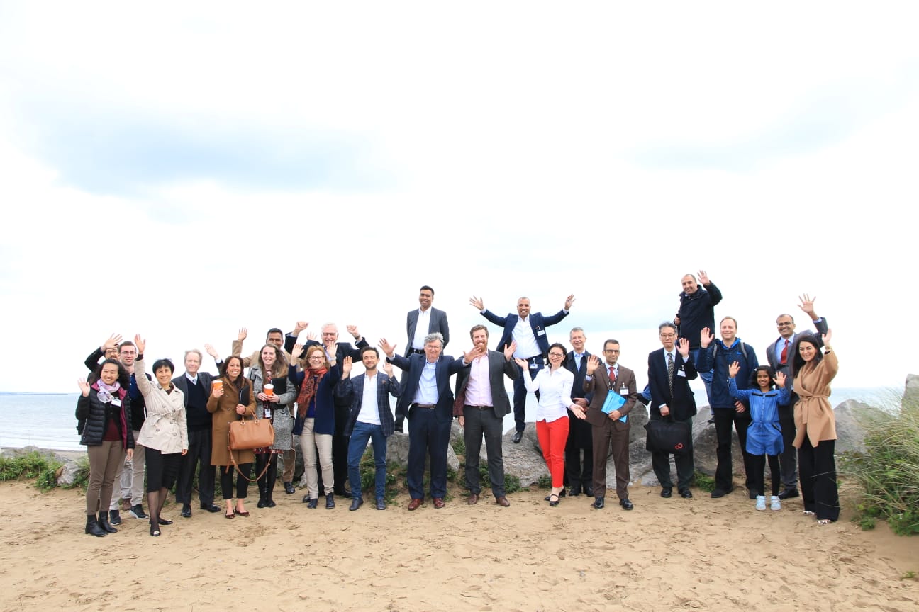 Participants posing on the beach