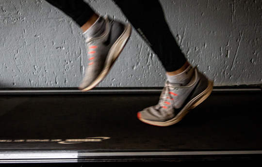 A person runs on a treadmill