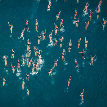 A group of swimmers in open water