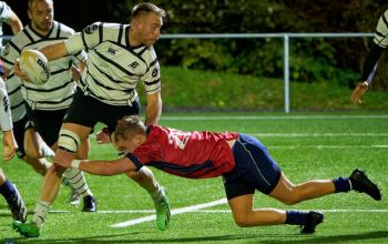 SSport scholar, Tom Boggemann, making a tackle in rugby fixture