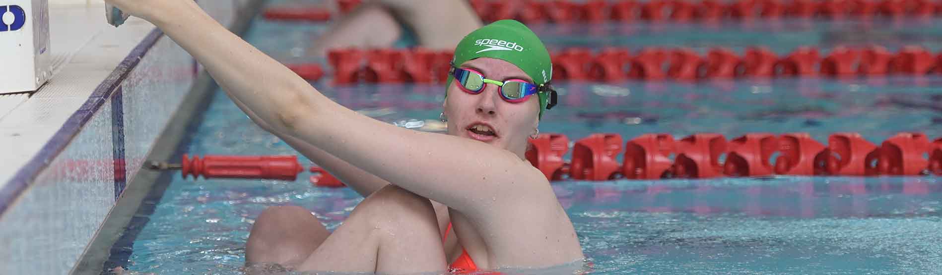 Swansea University student swimmer in pool at Wales National Pool