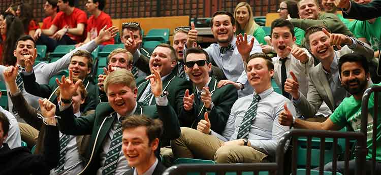 Swansea University students support from stands in Sports Hall at Swansea Bay Sports Park