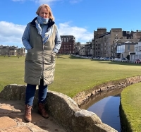 Dr Denise Hill standing on St Andrews Golf Course