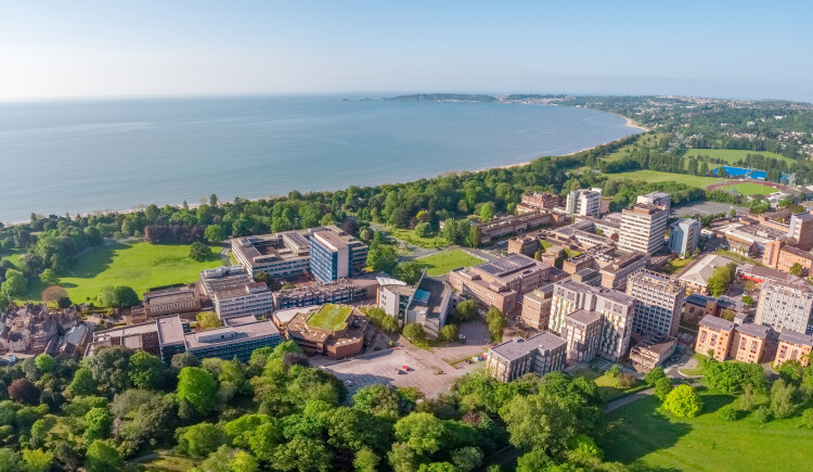 Aerial view of singleton campus with the sea in the background