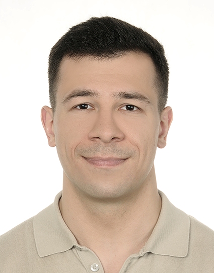 A headshot photograph of Oskar on a white background. 