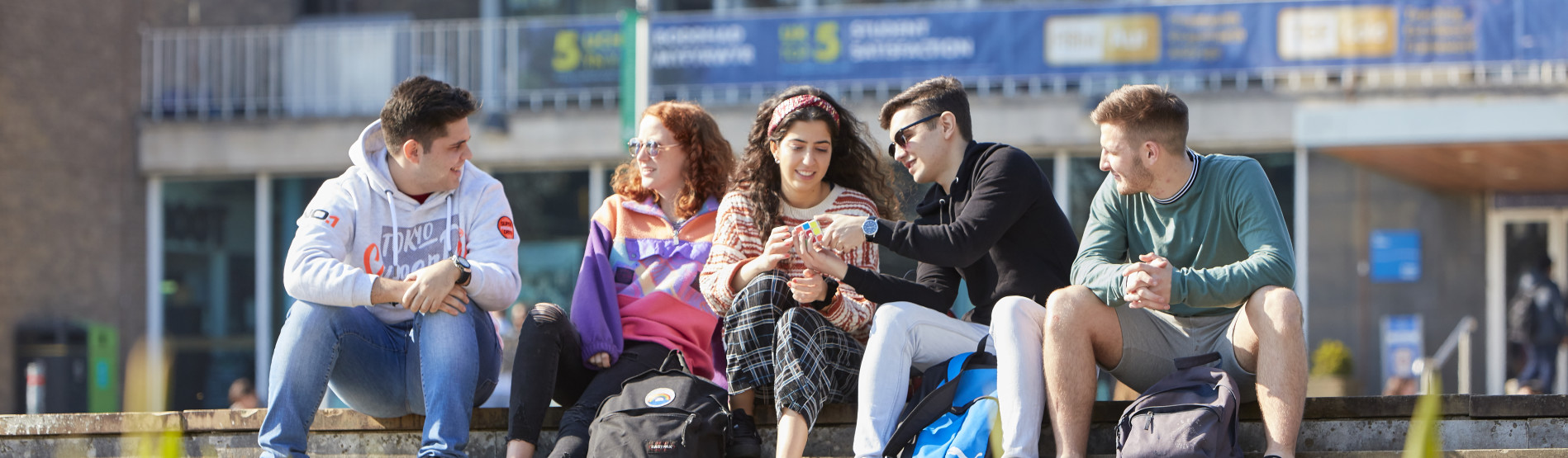 Students sitting outside Fulton House