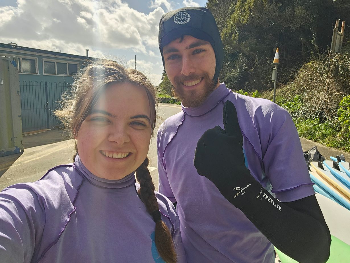 Students in wetsuits in Caswell Bay
