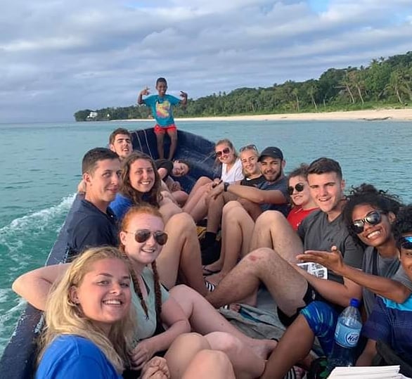 Students on a boat in Fiji